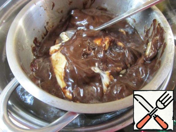 Melt the chocolate and butter in a water bath.
