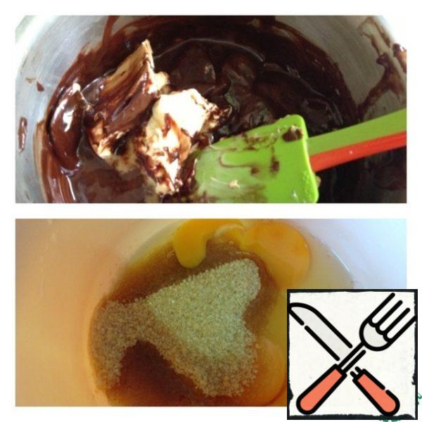 Melt the chocolate and 100 g of butter over low heat.
