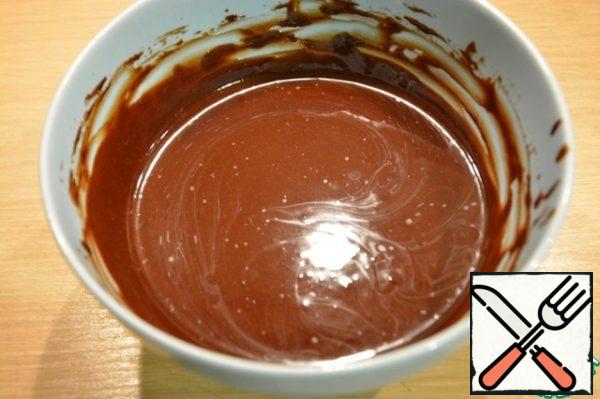 Melt the butter (in a microwave or in a saucepan on fire) and stir it with cocoa powder.
