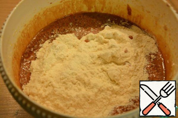 Pour the sifted flour with baking powder and salt. Beat with a mixer until smooth.