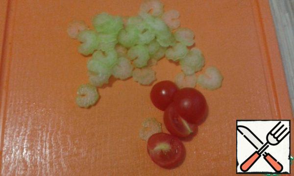 Slice the celery stalk and cherry tomatoes.
