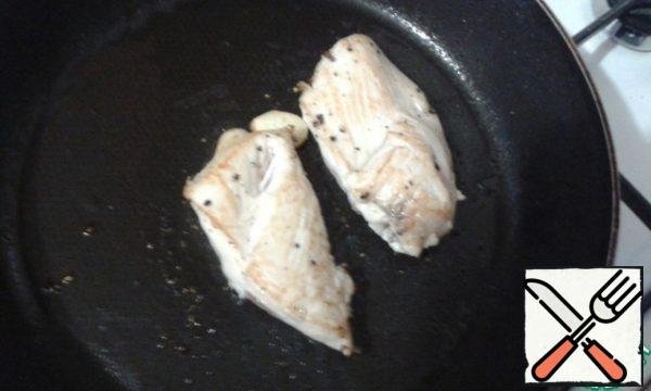 Season the chicken breast with salt and pepper and fry until soft.
