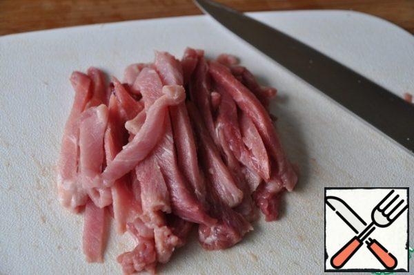 Slightly thawed pork cut into thin strips. You can take chicken, but the dish will be drier.