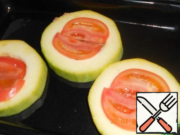 Put the tomato on top.
