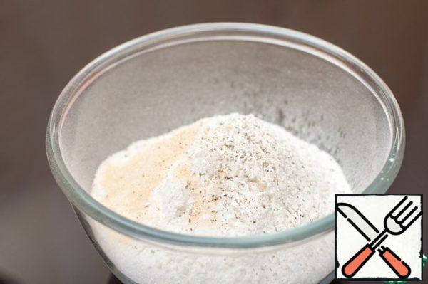 Sift flour, add salt, sugar and ground black pepper.