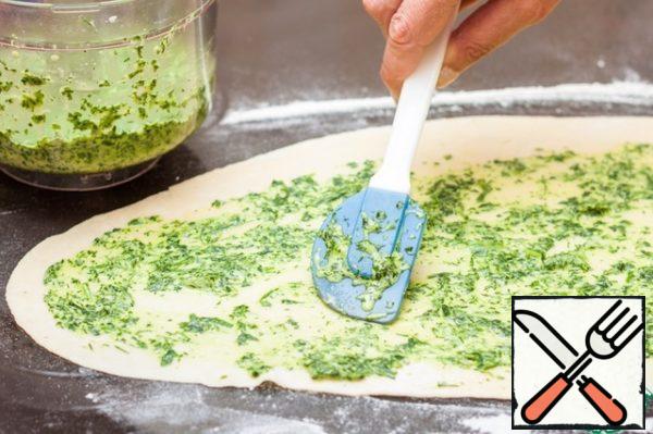 Grease the dough with green oil.