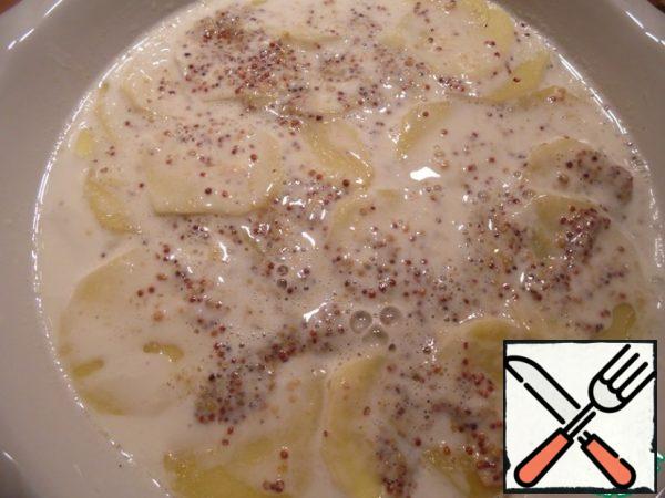 In cream add mustard, mix well. Pour the sauce over the potatoes. Heat oven to 180°, bake for 25 minutes.