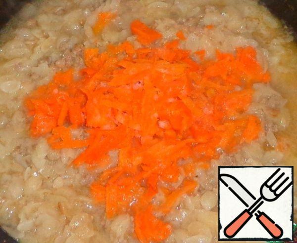 Add grated carrots and mix.