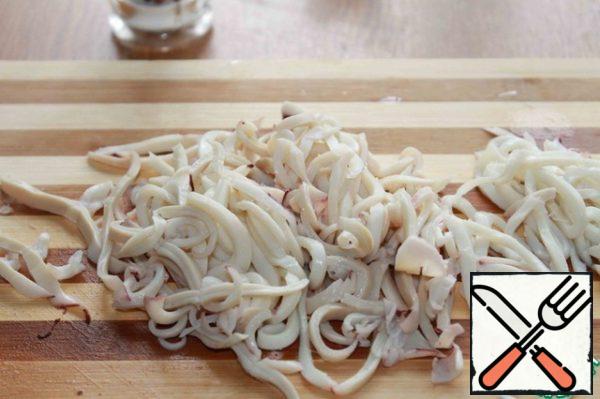 Squid cleaned, put in boiling water, boil 2 minutes and remove from heat. Cool and cut into strips. Squid can be cooked any other way.