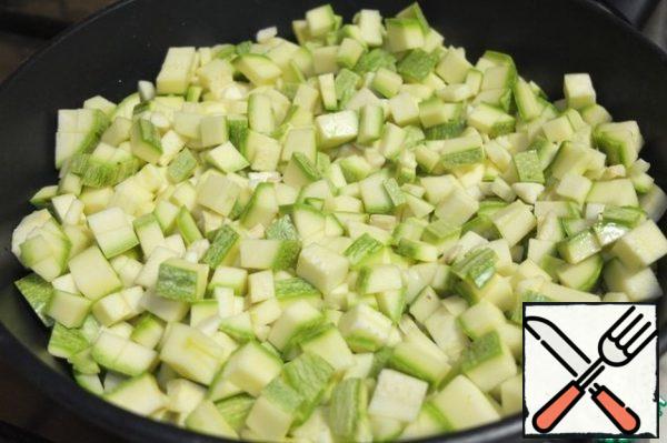 Add the finely diced zucchini and finely chopped garlic.

