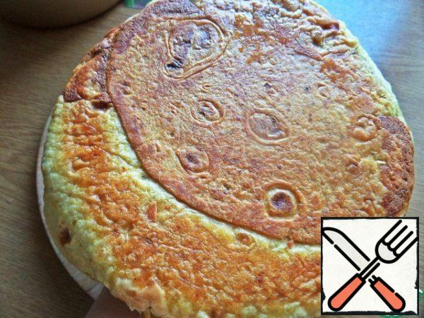 Cover with a plate, turn the pie over (not hot, but slightly warm) and watch it fry from the bottom.
