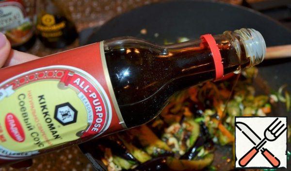 Pour soy sauce over it.
Stir, remove from heat.
