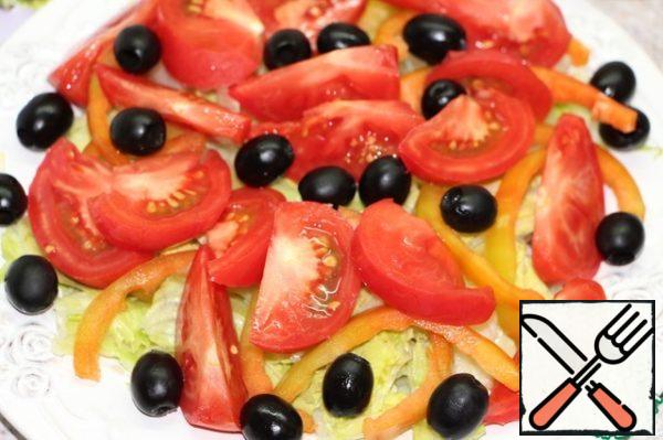 Then tomatoes, sliced, and olives.

