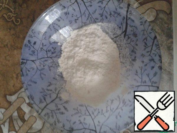 In a bowl pour the flour.
