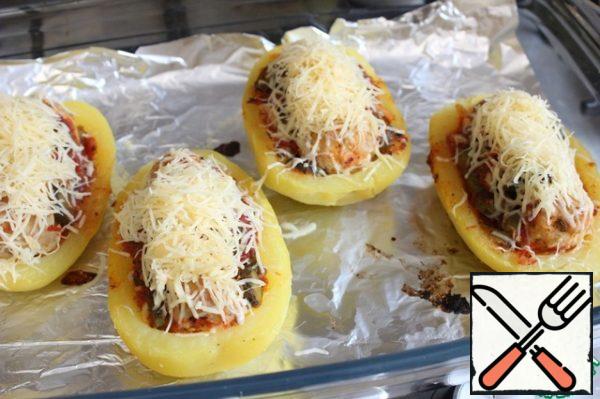 Put the potatoes in a preheated 200 degree oven for 15 minutes.
Then carefully remove the baking sheet and sprinkle the potato halves with cheese grated on a fine grater.