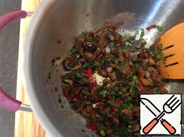 In a saucepan add green onions, cilantro, hot pepper, crushed garlic, paprika, cumin, oregano, Cayenne pepper, soy sauce. I added sweet, naturally brewed soy sauce, which has impeccable quality. Mix well and simmer under a lid on low heat for 7-10 minutes.