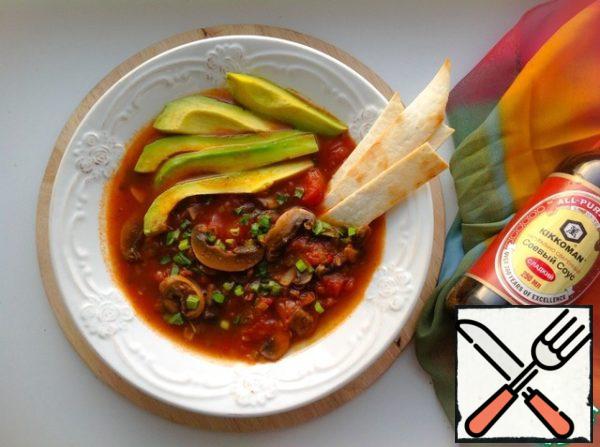 Pour the soup on plates, sprinkle with herbs, garnish with avocado slices and crispy tortilla.
Enjoy your meal!