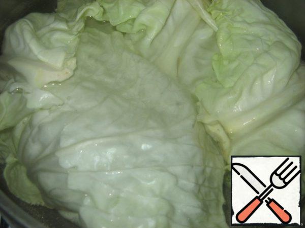 Cabbage disassemble on leaves and boil in salted water 10-15 minutes.