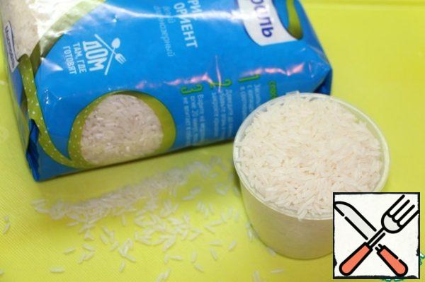 Boil rice in salted water until tender.