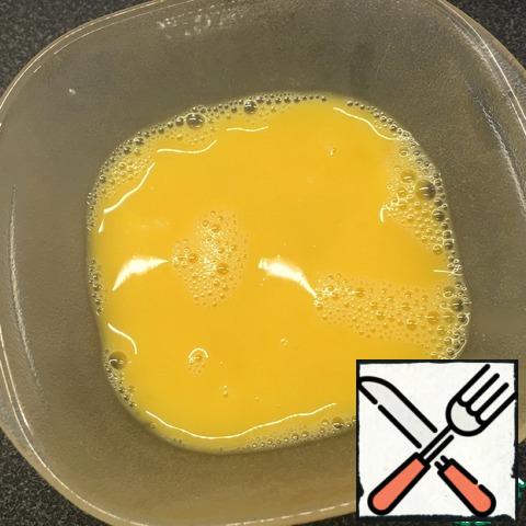 Beat eggs with a fork in a separate container with a pinch of salt.