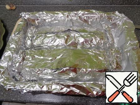 Wrap the brisket in foil. I made two parcels. Transfer to a baking sheet seam up.