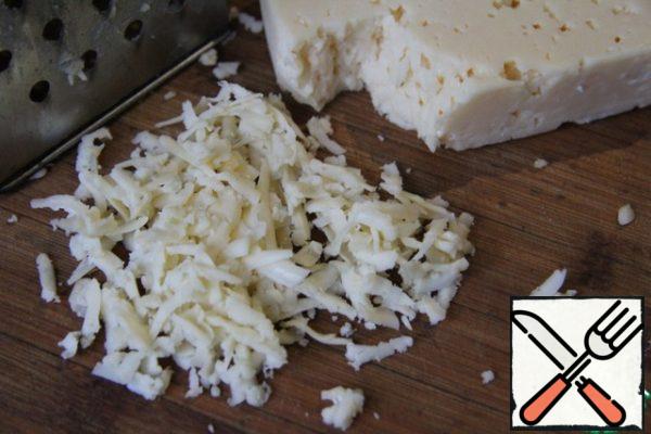Pour the grated cheese and boil everything for another 5-7 minutes.