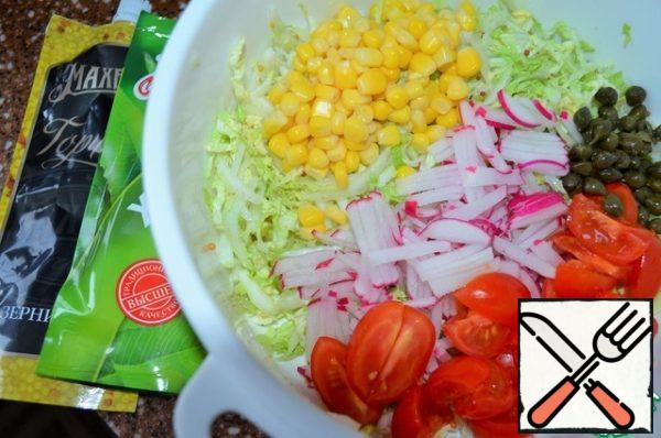 Slice the cherries for the salad.
Put the capers in the salad.
