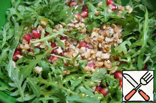 Leave a few halves of walnuts for decoration, chop the rest with a knife and add to a bowl.