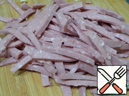 Sausage, too, cut into strips.