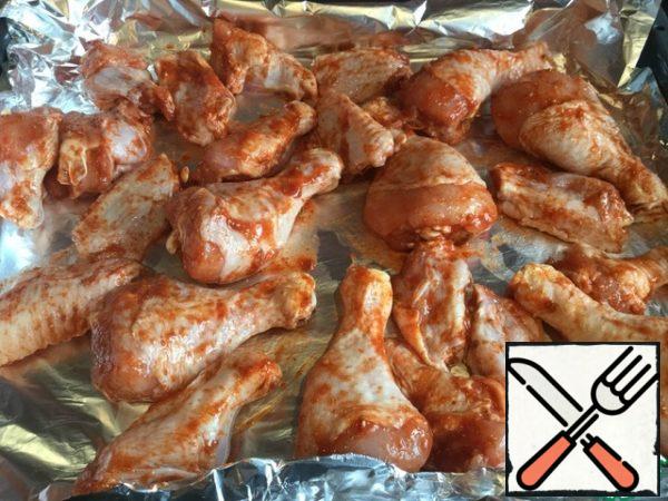 Place the chicken on a baking sheet and cook in a preheated oven on the Grill at 180 degrees.