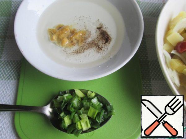 To prepare the dressing, mix vegetable oil with mustard, sugar, salt, vinegar and black pepper. Then add finely chopped green onions.