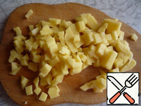 Peeled potatoes cut into small cubes.
