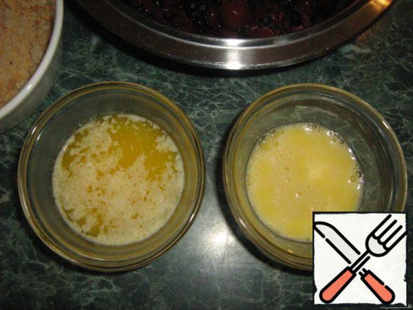 Melt the butter. Beat one egg plus one yolk from the second egg. Whisk the whites of the second eggs separately.
