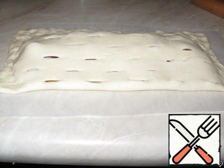 Cover with other half of dough and place in the oven for about 30 minutes at the temperature of -35. 180-200 degrees.
