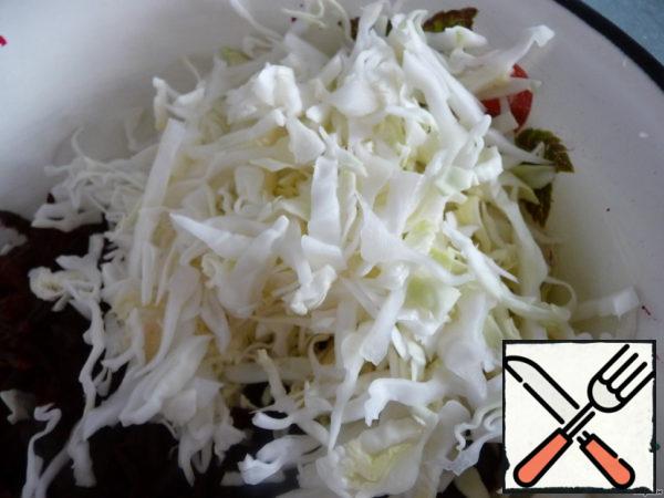 Chop the cabbage into thin strips.