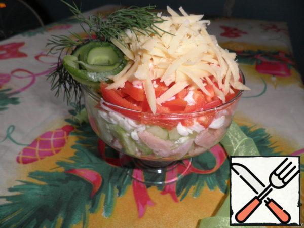 Cheese grate, it will be the last layer. Salad decorate with a sprig of dill and cucumber. Each layer is lightly lubricated with mayonnaise.