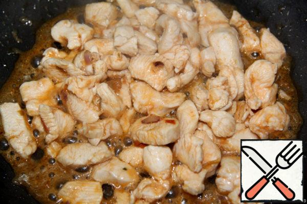 Fry the chicken until tender.
