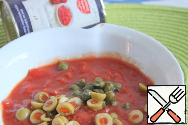 Sauce: add capers and olives, cut into rings, into canned tomatoes, cut into slices (finished product). (Capers can be replaced with 1 pickled cucumber).
Add to the sauce 0,5-1 tsp sugar.