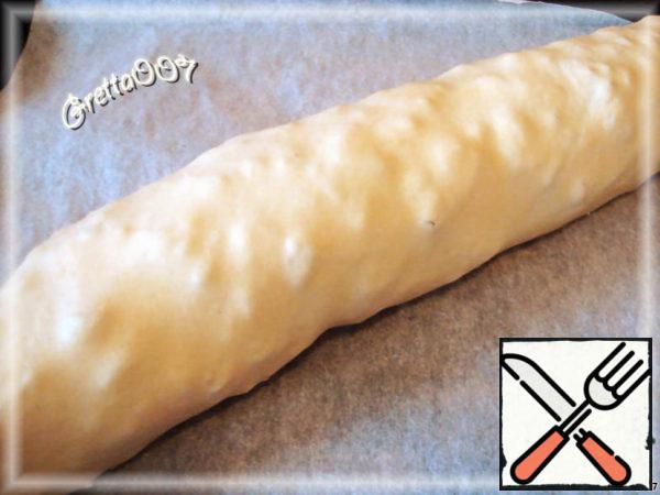 Roll the roll. Carefully place on a baking sheet.
