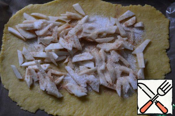 Put the apples on the dough, sprinkle with sugar and cinnamon to taste. Roll out the dough with the filling.
Strudel can be greased with yolk and baked in a preheated 180 degree oven until ready for 20-30 minutes.
From this amount of ingredients I got 2 small strudels.