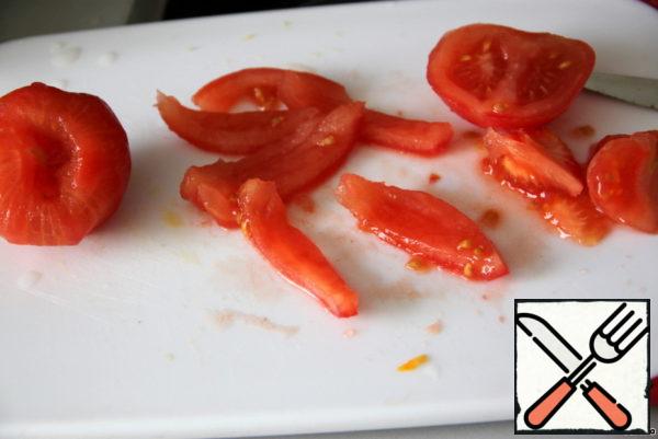 Tomatoes cut crosswise, scalded with boiling water (or blanch in boiling water for a few minutes), then - pour cold water, remove the skin. Cut into quarters and remove the seed portion (use the seed pulp and juice for tomato soup or sauce). Cut the firm flesh into strips.