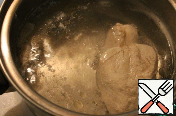 A chicken breast to boil and allow to cool in the broth.