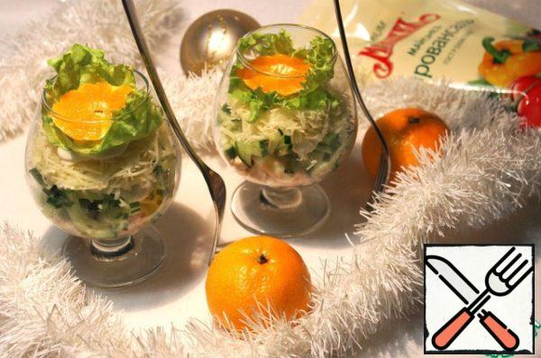 Put a layer of cheese on top, lettuce leaves on it and garnish with a slice of tangerines.
