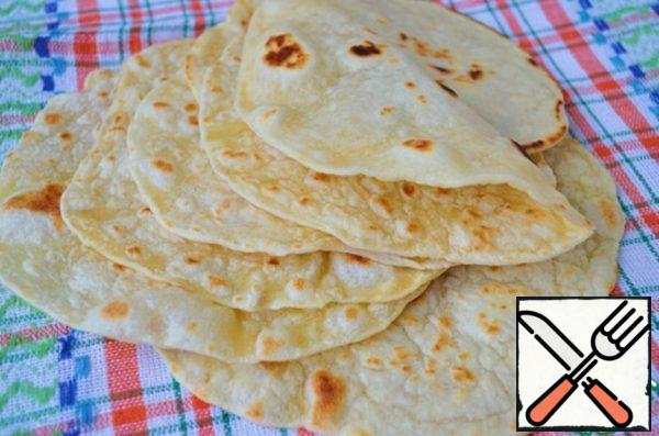 The tortillas are ready, and now you can cook whatever you want - burritos, tacos, fajitas or just put greens and cheese in the tortilla and enjoy! Keep it in a bag so it doesn't dry out! Enjoy your meal!