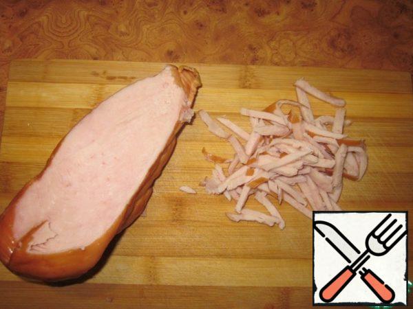 Cut the chicken breast into strips.
