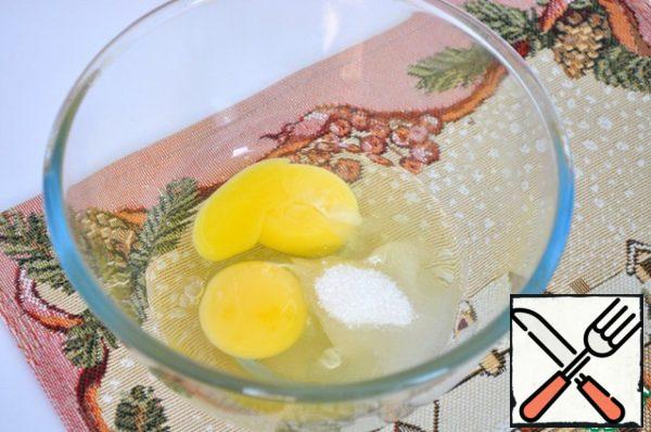 Eggs with a small amount of sugar is whipped to a froth.