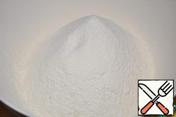 Sift the flour, add 1 tsp salt and a pinch of sugar.
