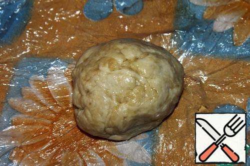 Knead a soft dough of flour, vegetable oil and water.
Thus water add last and gradually until, until the dough no longer sticks to hands.
Roll the dough into a ball, lightly lubricate with vegetable oil, wrap with cling film and leave warm for about half an hour.