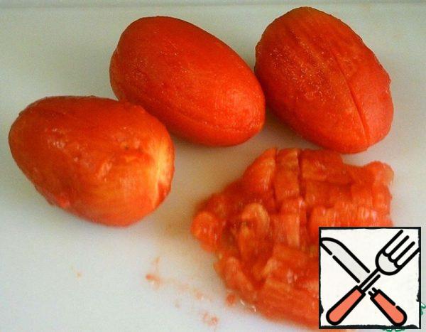Scald tomatoes, peel, finely chop.
