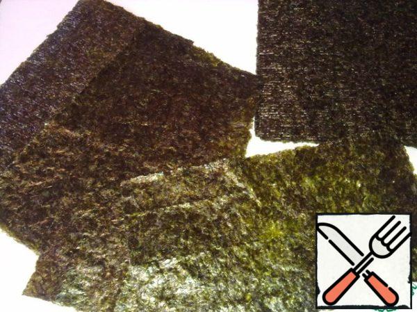 Cut the nori sheets in half.
